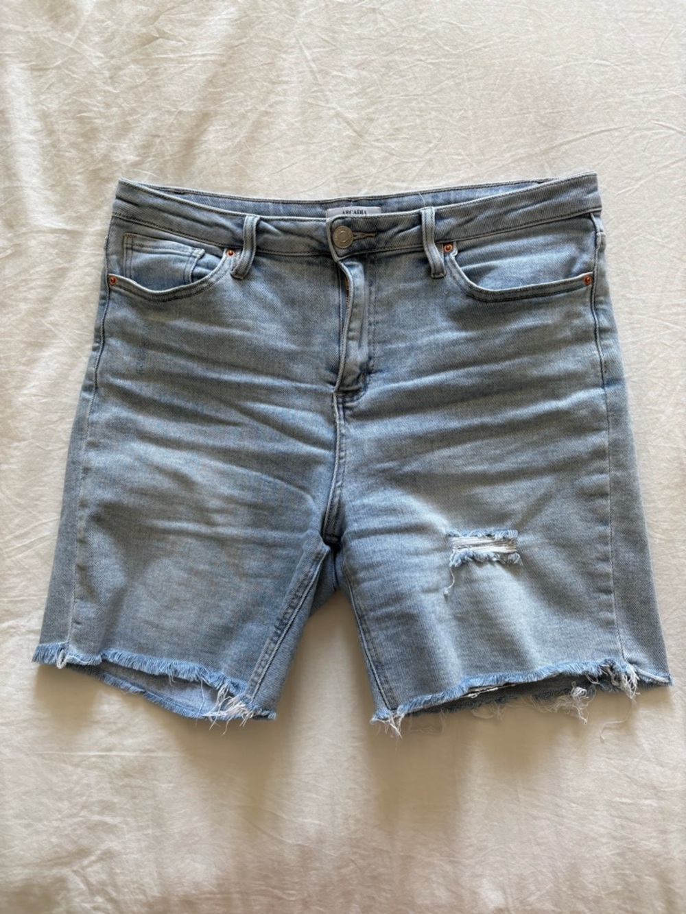 High Rise Light Blue Distressed Jean Shorts
